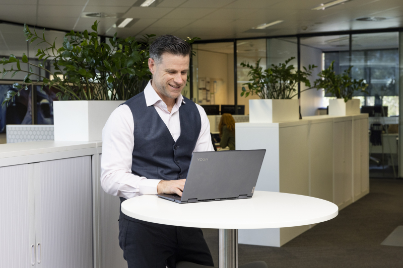 Craig, a business loan broker, working on his laptop at Ledge Finance.