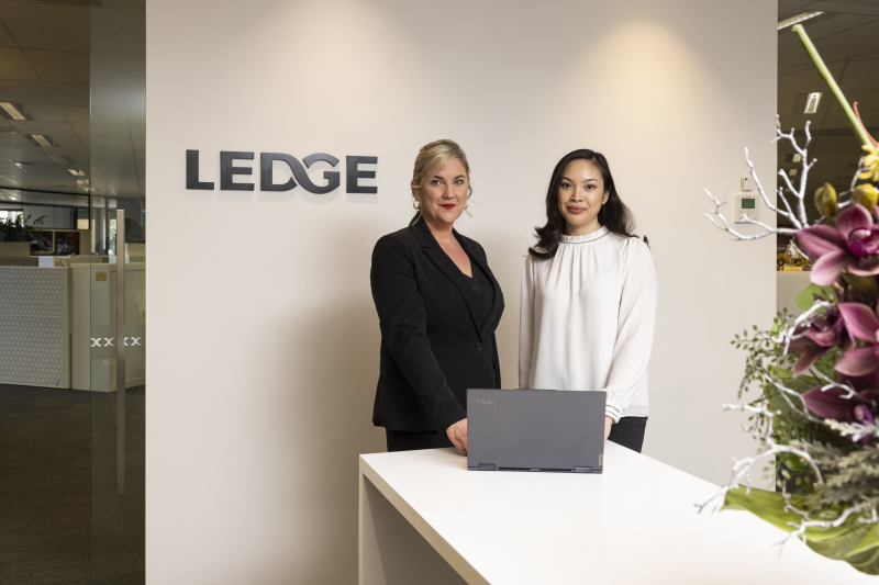 Elaine and Jenny standing at the front desk in the Ledge reception area.