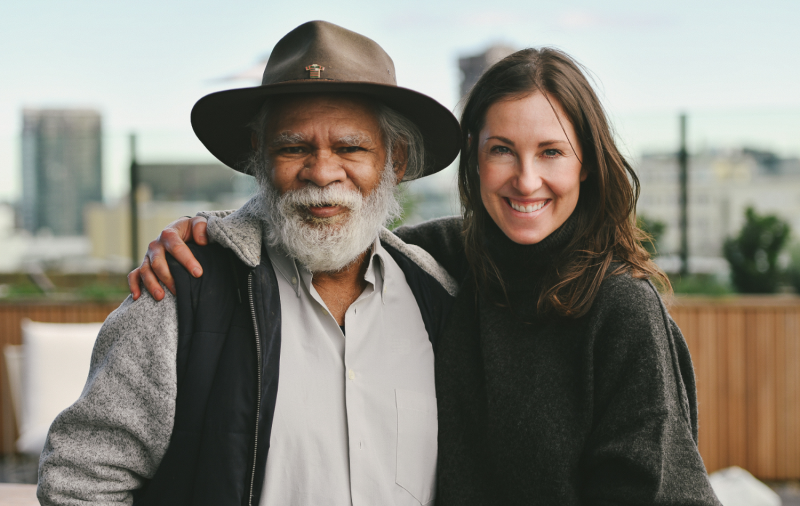 Two Indigenous Australia's smiling.