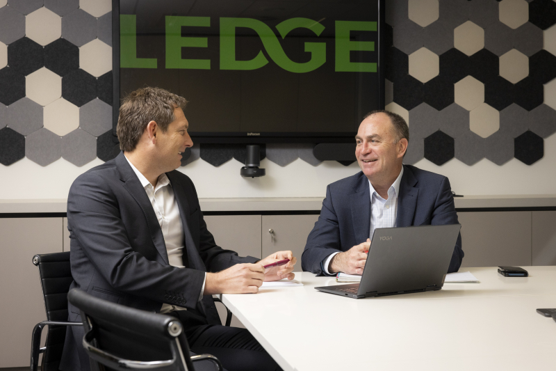 Australian equipment finance brokers Isaac Hough and Brad Spencer from Ledge, having a meeting in the boardroom.