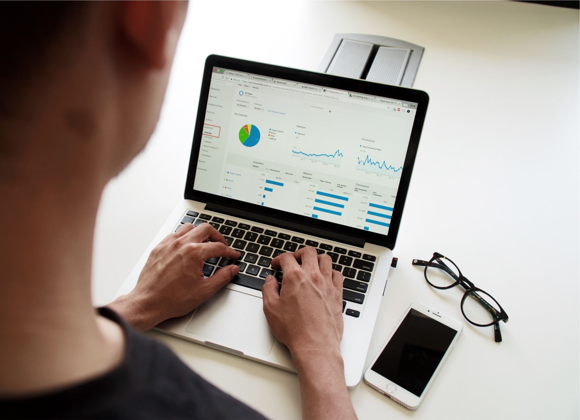 Person using laptop to look at small business finance report