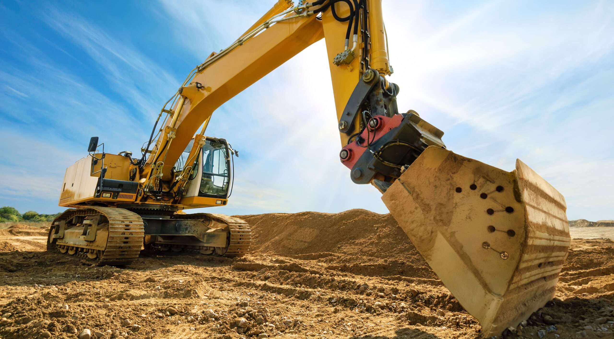 Excavator with blue sky in the background.